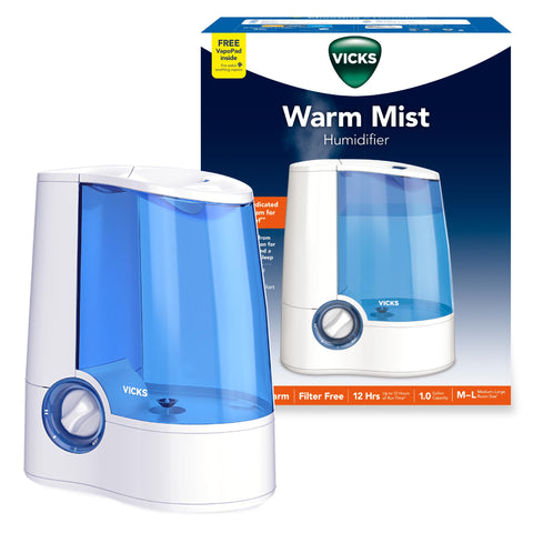 Vicks Warm Mist Humidifier front view with visible mist and compact design