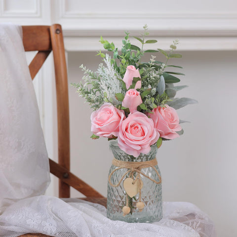 Vierena artificial eucalyptus with pink vase enhances farmhouse dining area.