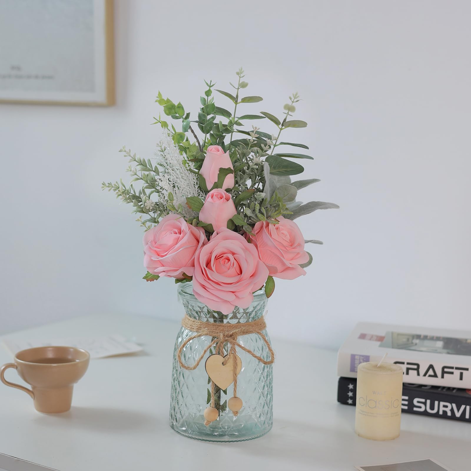 Vierena flocked lambs ear arrangement in pink vase adds texture.