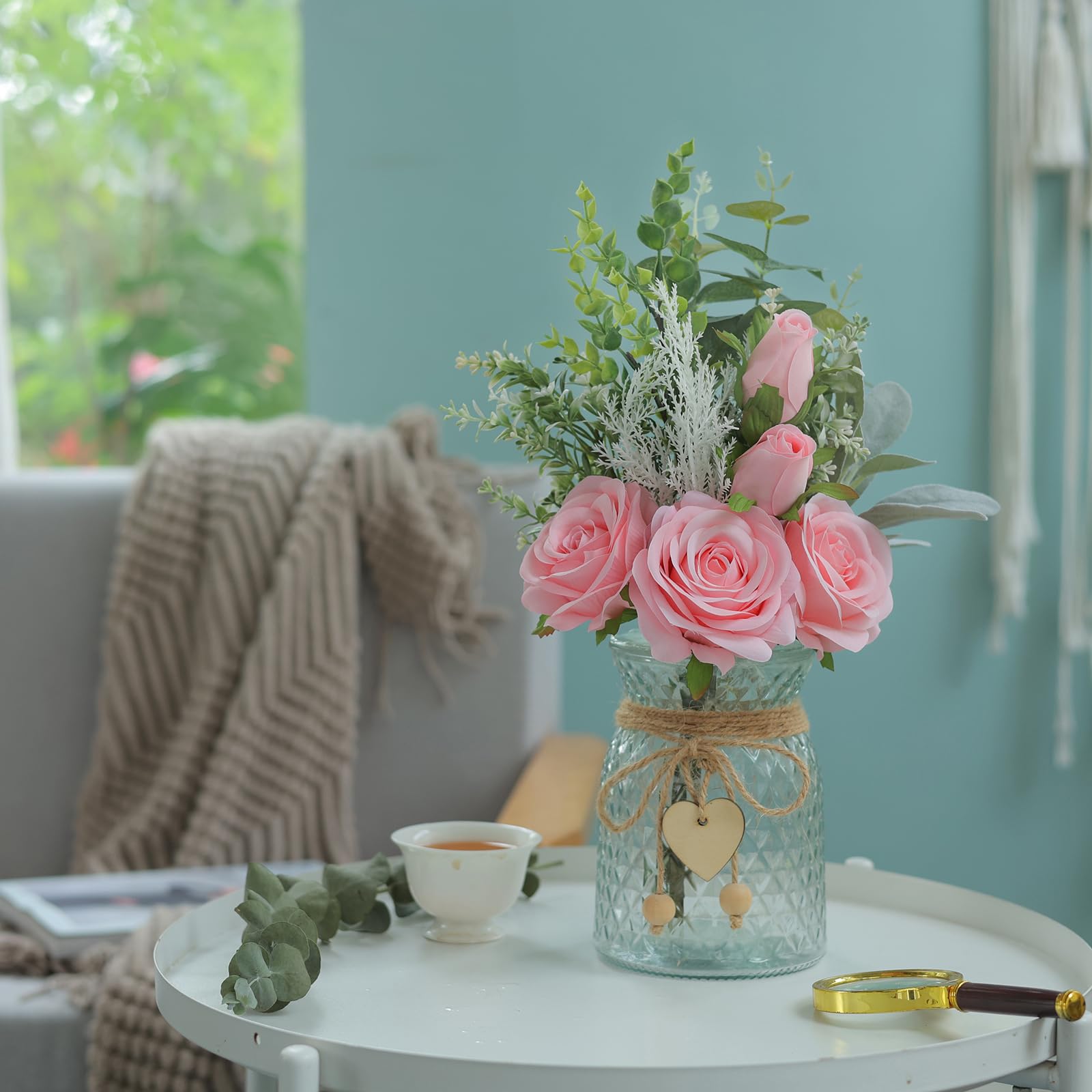 Vierena glass vase with heart pendants complements rustic shelves.
