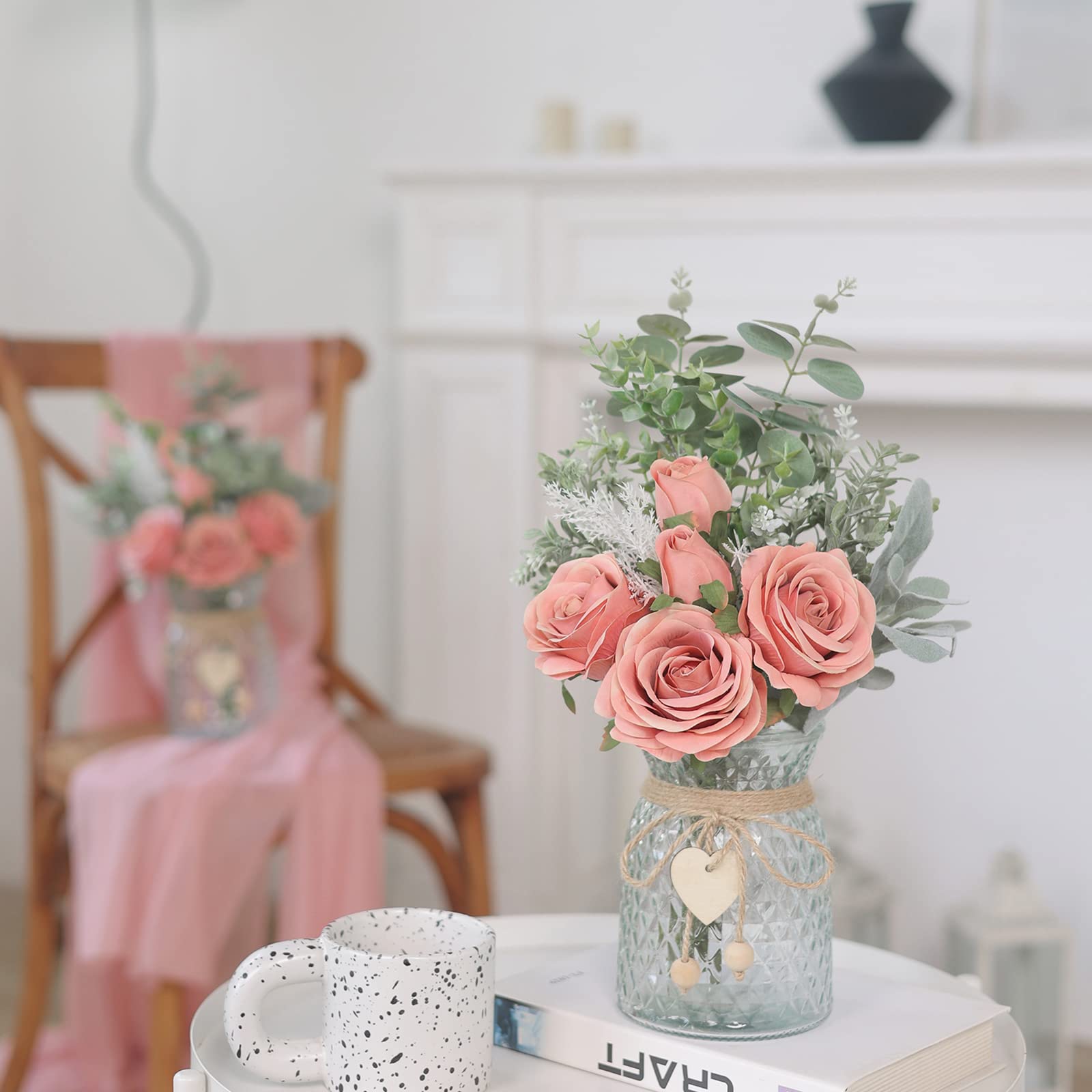 VIERENA roses and eucalyptus arrangement in vase enhances living room ambiance