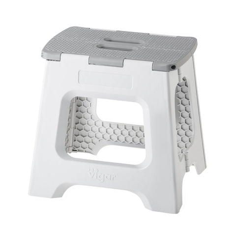 Vigar compact step stool folded, ideal space-saving storage beside cabinets.
