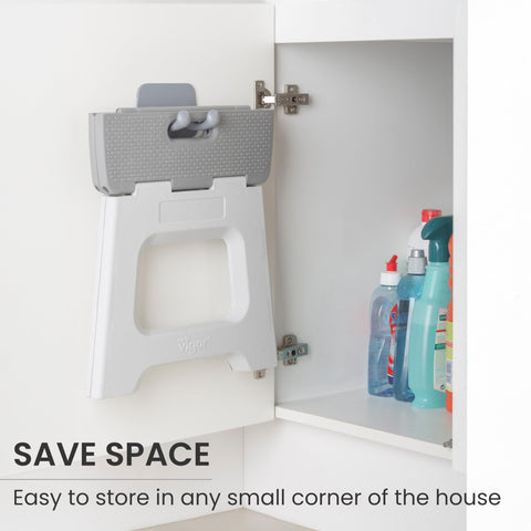 Vigar compact step stool in kitchen, reaching tall cabinets.