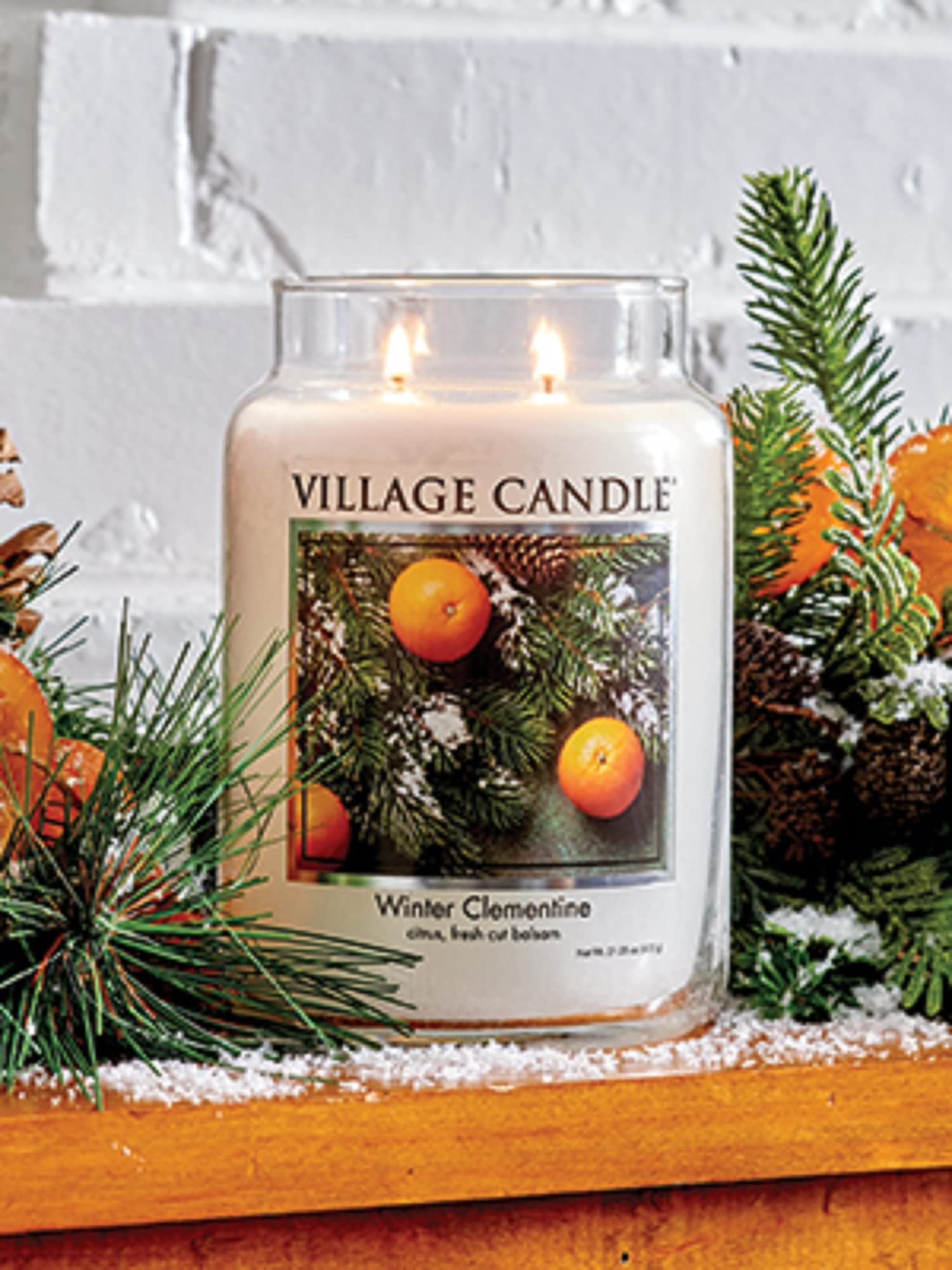 Village Candle fragrance notes citrus and balsam evoke wintry ambience for home decor.