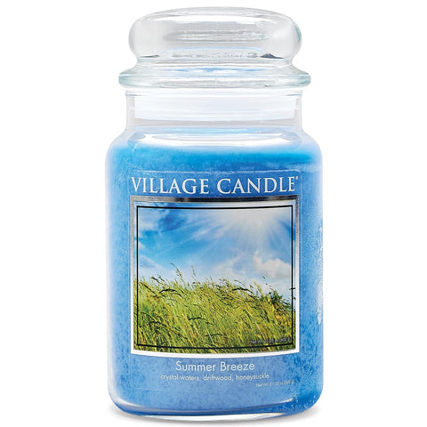 Village Candle Summer Breeze large glass jar in ocean blue for a cozy living room ambiance.