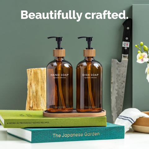Amber glass dispenser close-up highlighting the bamboo pump and durable design.