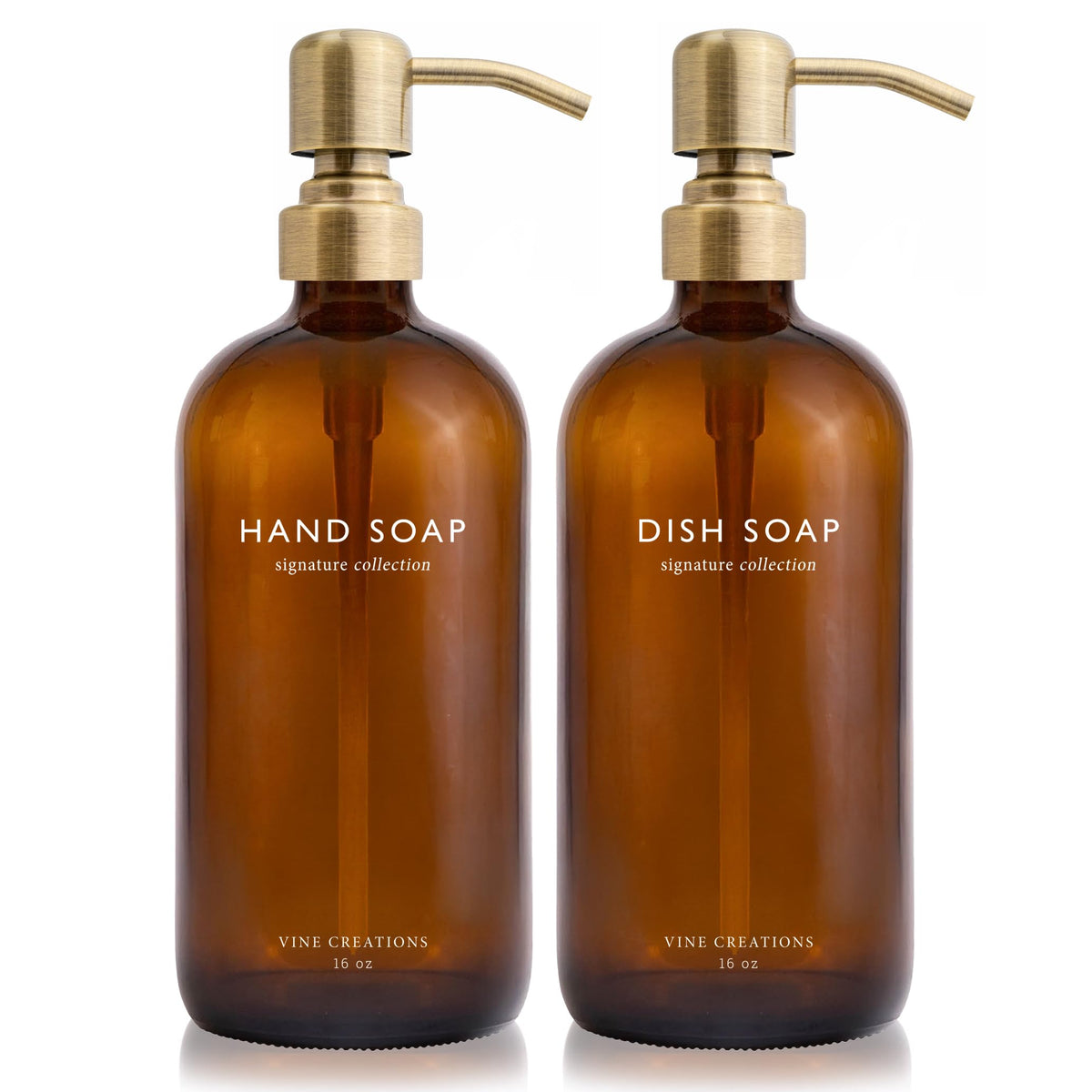 Vine Creations amber glass soap dispenser set with a brushed brass pump on the countertop.