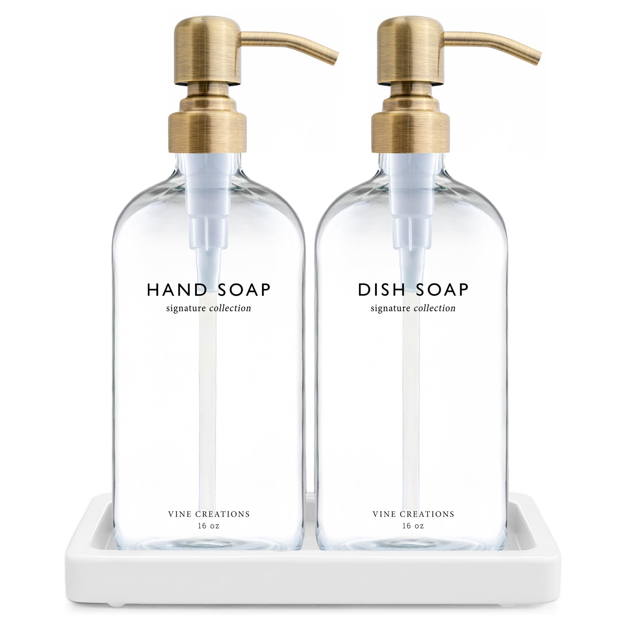 Vine Creations glass soap dispenser set with brushed brass pumps on a stylish counter.
