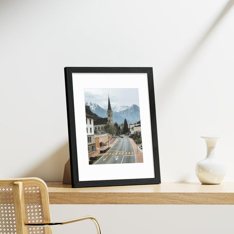 Nine frames mounted on a wall showcasing a cohesive gallery.