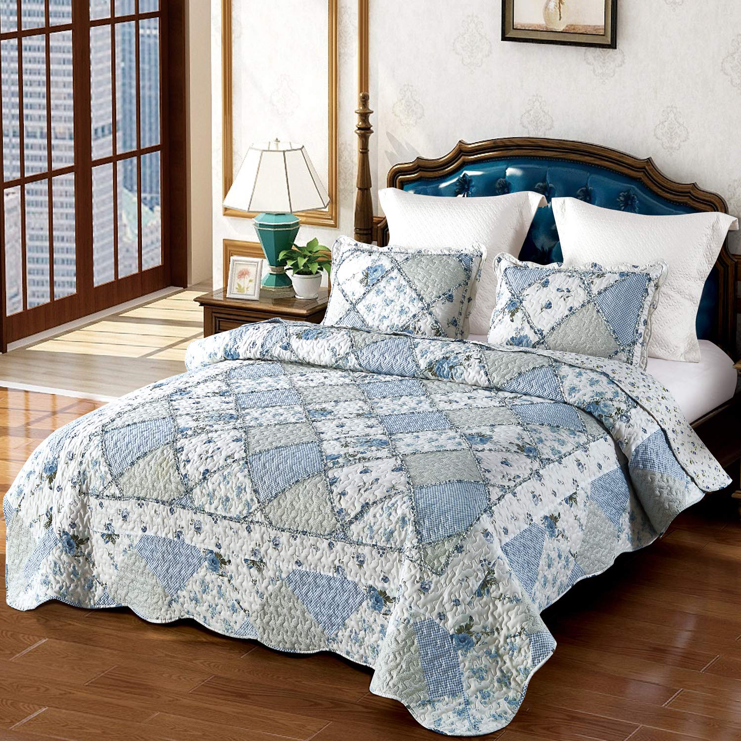 VIVILINEN blue floral patchwork quilt king bedspread in a modern bedroom.