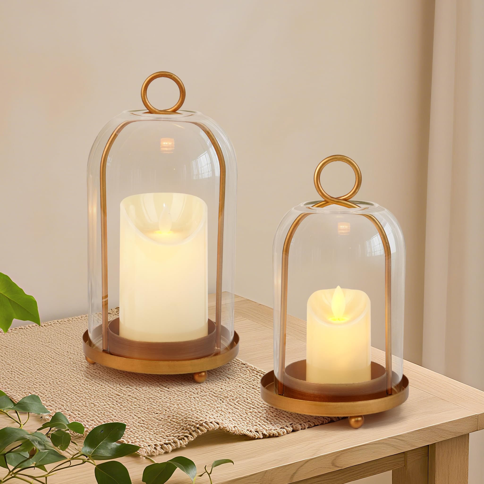VIVIRENOIR glass hurricane candle holder in antique brass enhances warm ambiance.