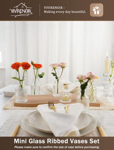Neutral clear vase styled on a shelf in modern decor