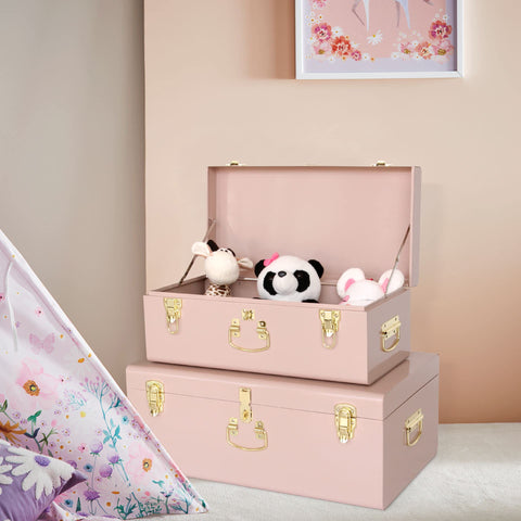 Sunken handles integrated into the pink trunk sides for easy transport.