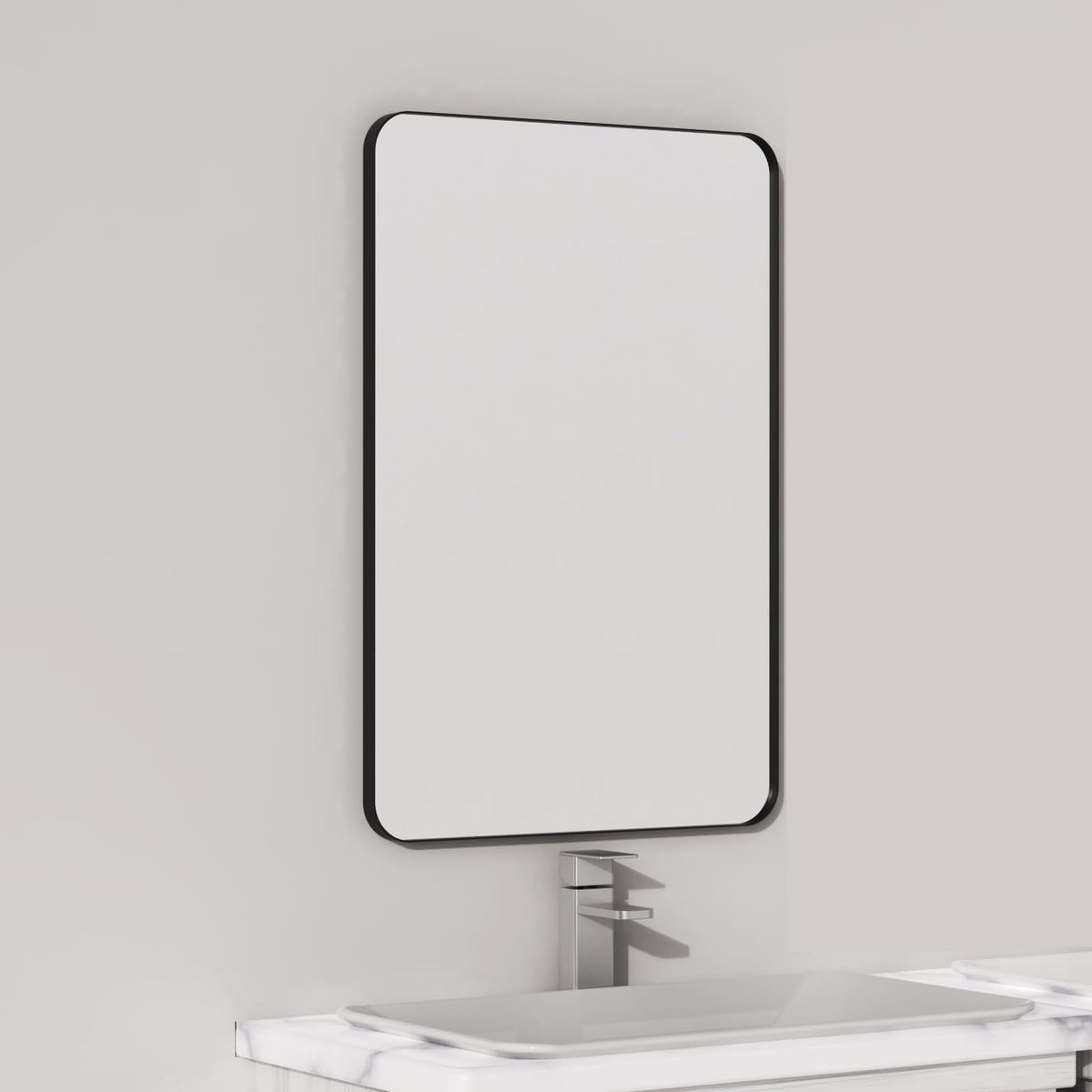 VocalStar mirror with 16x24 black metal frame mounted over a bathroom vanity for balanced, bright reflections.