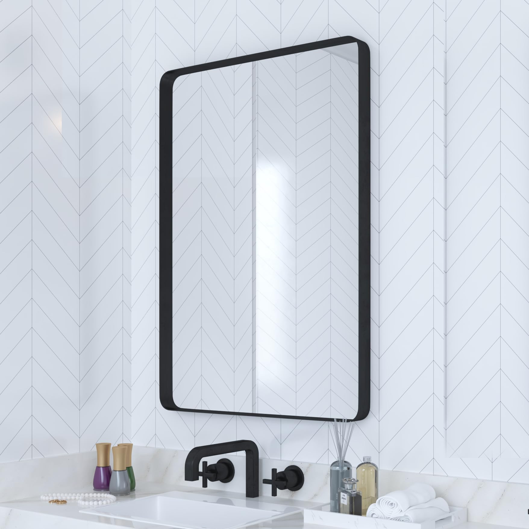VocalStar black bathroom mirror with 18x26-inch rounded frame over a vanity.