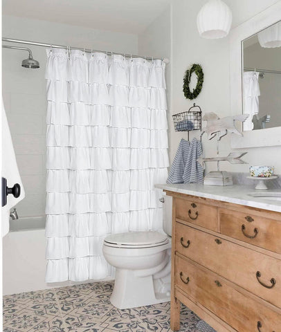 Volens white ruffle shower curtain in a bright bathroom