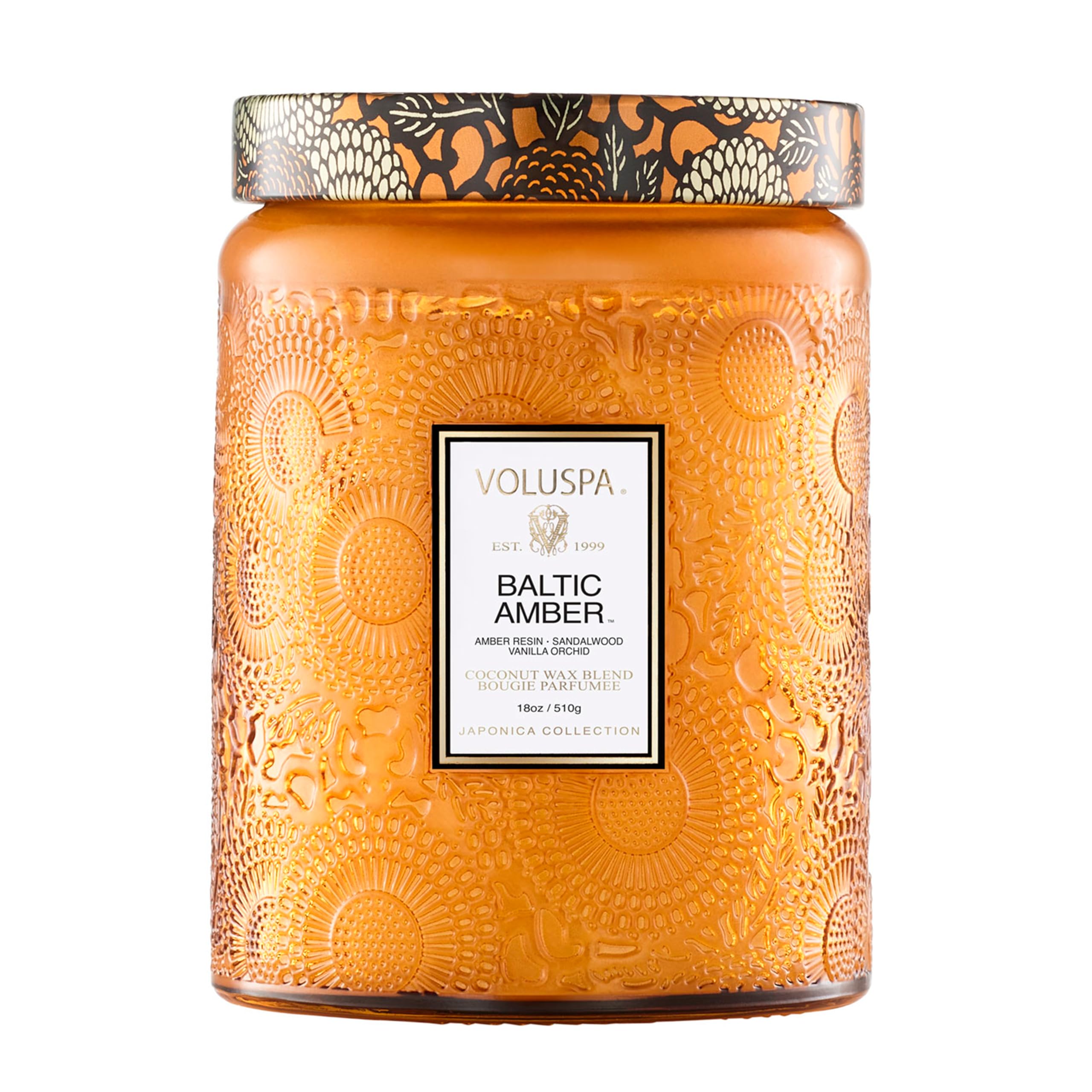 Voluspa Baltic Amber Candle Jar glowing warmly, ideal for cozy living spaces.
