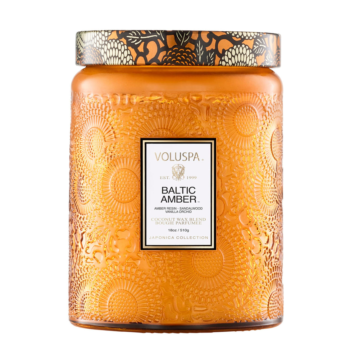 Voluspa Baltic Amber Candle Jar glowing warmly, ideal for cozy living spaces.