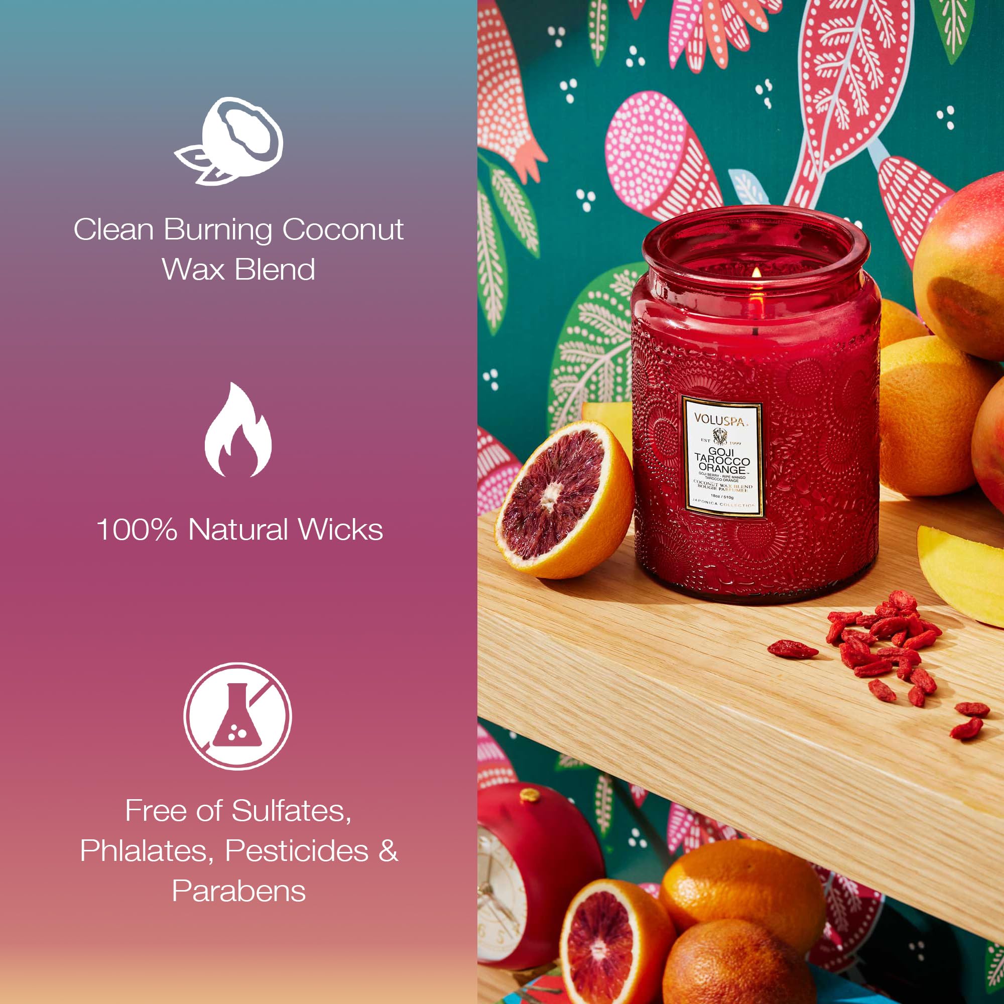 Voluspa Goji Tarocco Orange candle emits a cozy amber glow, enhancing living room ambiance.