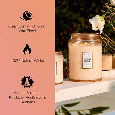 Voluspa Jasmine Midnight Blooms candle on coffee table elevates the living space.