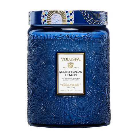 VoluspaMediterranean Lemon candle jar embossed closeup enhances living room ambiance