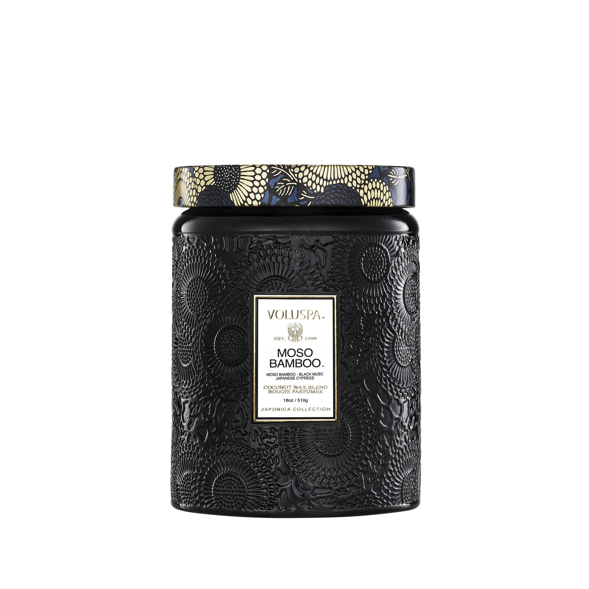Voluspa Moso Bamboo candle 18 oz in a sleek jar adds woodsy ambiance.