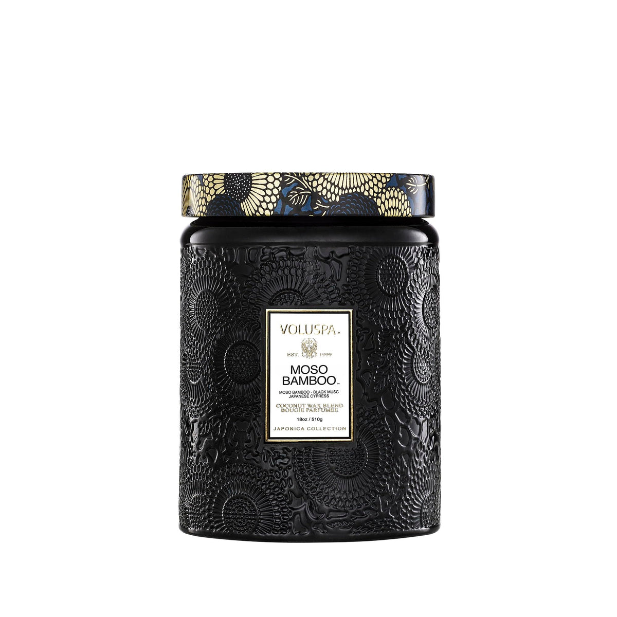 Voluspa Moso Bamboo candle 18 oz in a sleek jar adds woodsy ambiance.