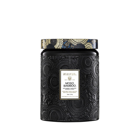 Voluspa Moso Bamboo candle 18 oz in a sleek jar adds woodsy ambiance.
