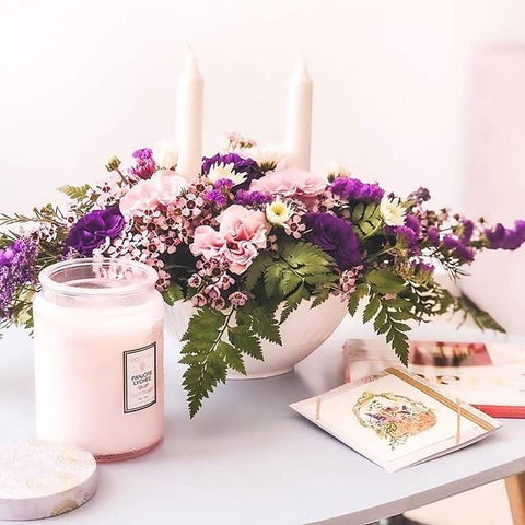 Voluspa Panjore Lychee candle side view highlighting ambient glow and USA craftsmanship.