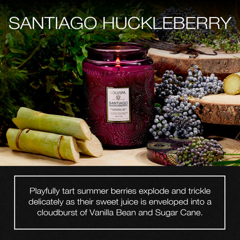 Voluspa Santiago Huckleberry flame with decorative jar enhancing cozy ambiance
