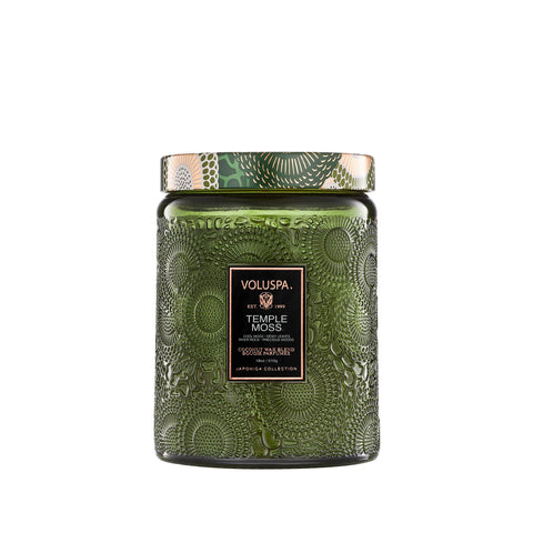 Voluspa Temple Moss candle jar front view, enhancing calm ambiance with earthy fragrance.