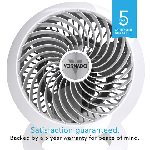 Vornado 460 compact desk fan on a nightstand for space-saving cooling.
