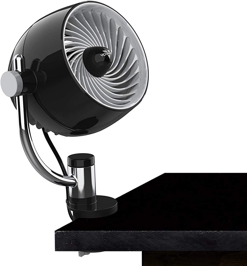 Vornado Pivot3 Clip on a desk delivering compact airflow for focused cooling.