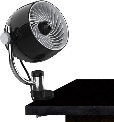 Vornado Pivot3 Clip on a desk delivering compact airflow for focused cooling.