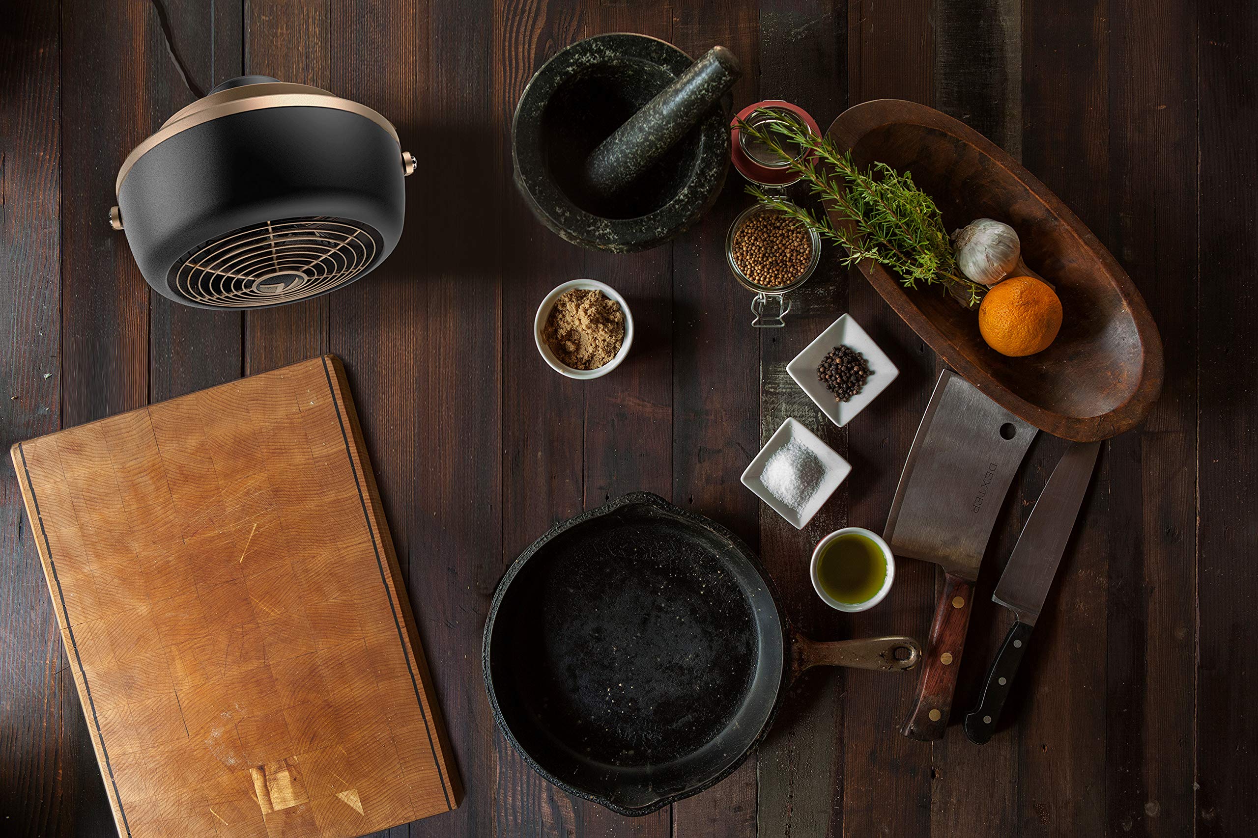 Tilt-head adjustment on Vornado VFAN Petite Alchemy enables directed cooling on a desk
