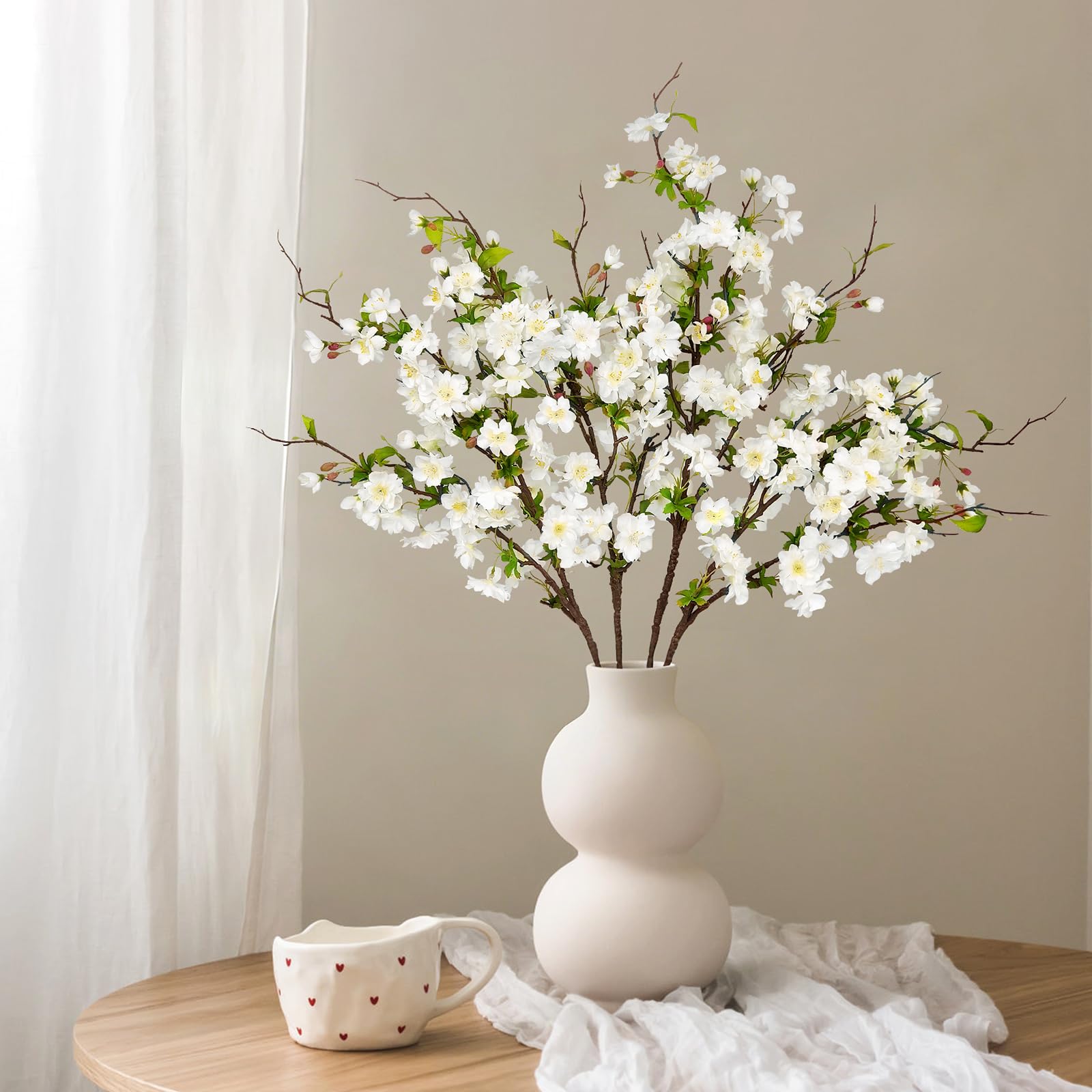 VUAHAUL branch shows three blossom stages from bud to bloom.