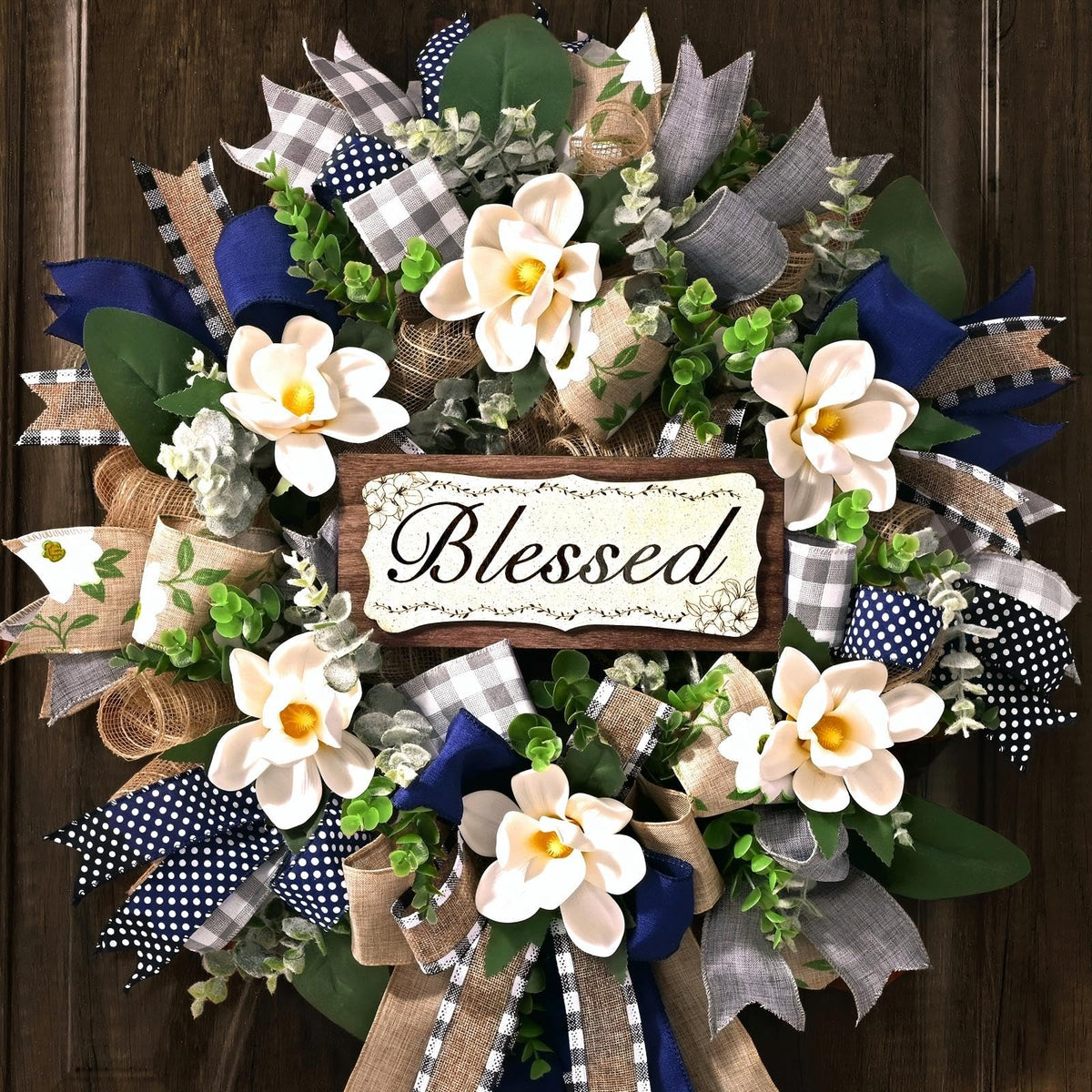 Waipfaru 22-inch Magnolia Wreath with eucalyptus greets guests; adds welcoming curb appeal.