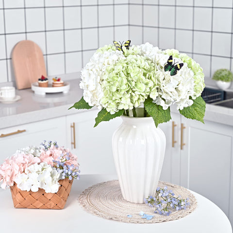 Waipfaru butterflies with hydrangea accent enhance romantic arrangements