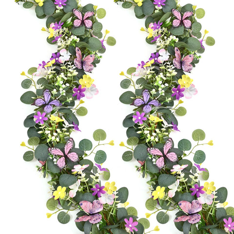 Waipfaru eucalyptus garland with daisies and 3D butterflies enhances table decor
