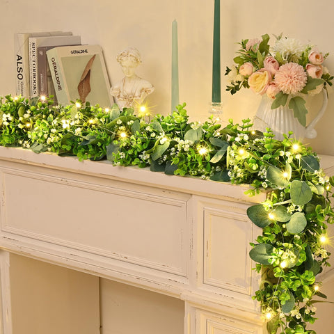 Waipfaru garland with mixed leaves and flowers—natural contrast with white blooms.