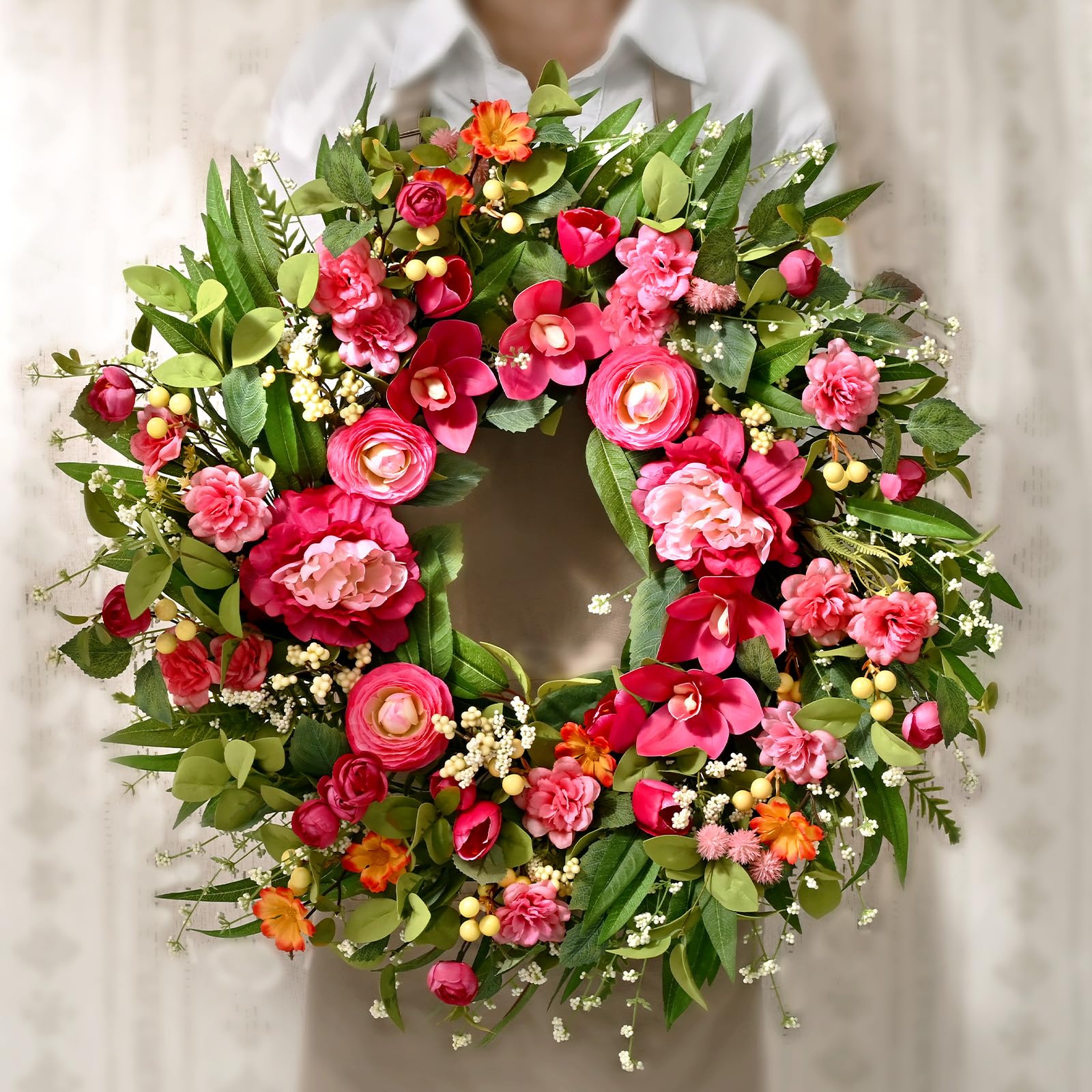 Waipfaru wreath features silk flowers and plastic leaves for lasting beauty.