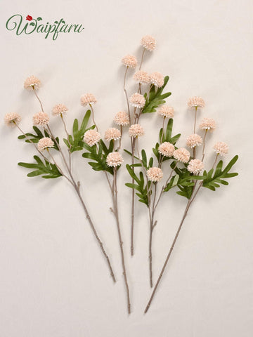Waipfaru wedding filler arrangement enhances tables with soft, airy blooms.
