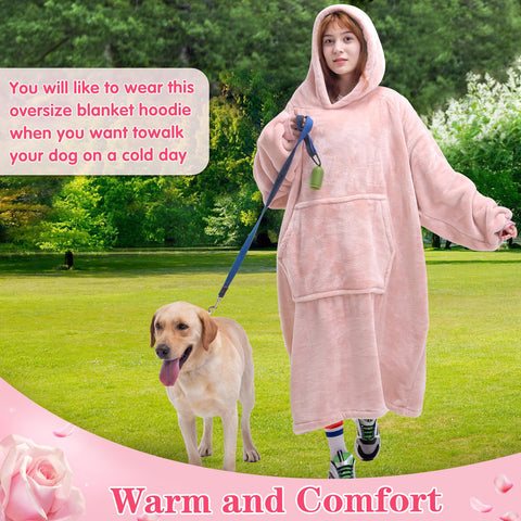 Waitu wearable blanket hoodie pink on sofa view captures cozy lounging moments.