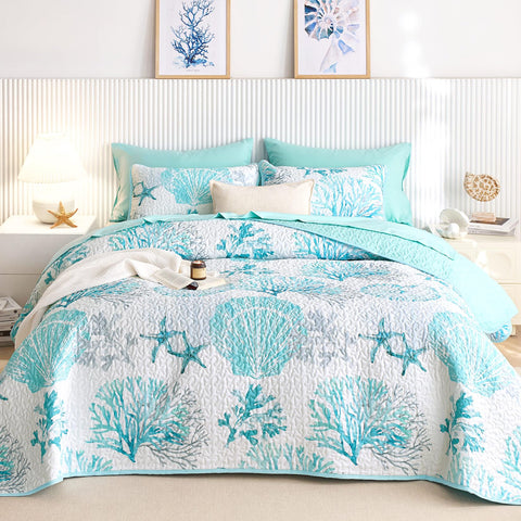 Wake In Cloud coastal quilt with aqua seashell pattern for a serene beach-inspired bedroom