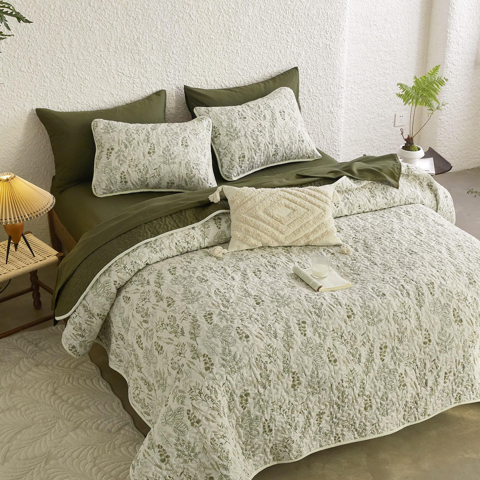Wake In Cloud olive-green reversible coverlet provides lightweight warmth for transitional seasons.