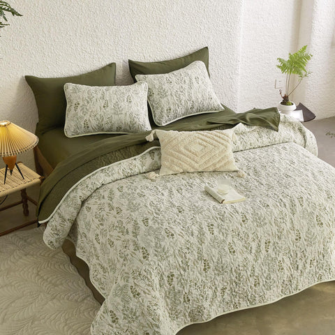 Wake In Cloud olive-green reversible coverlet provides lightweight warmth for transitional seasons.