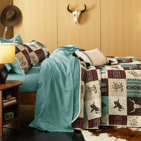 Wake In Cloud reversible bedspread shows turquoise taupe sides.