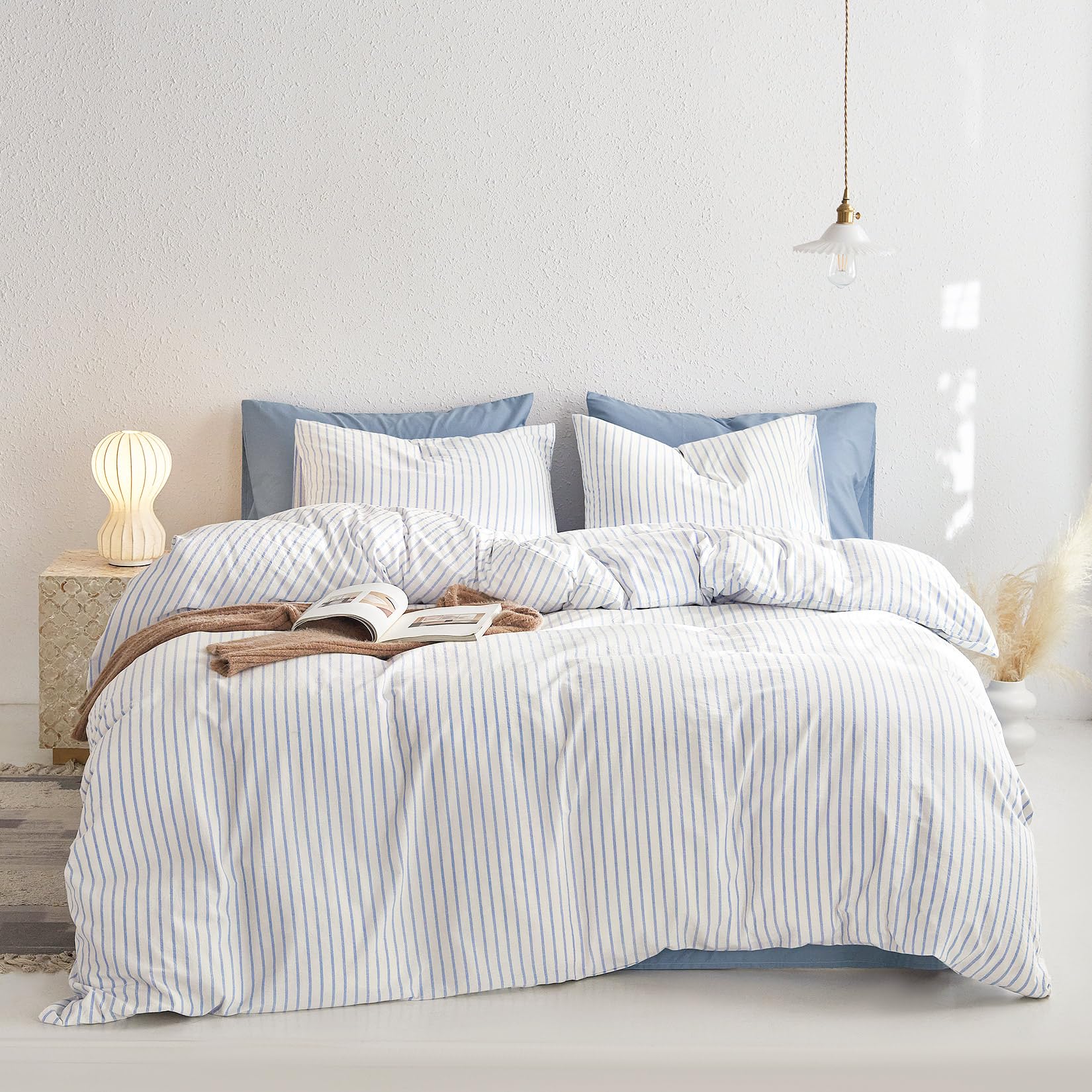 Wake In Cloud striped duvet pattern on bed highlights neutral farmhouse aesthetic.