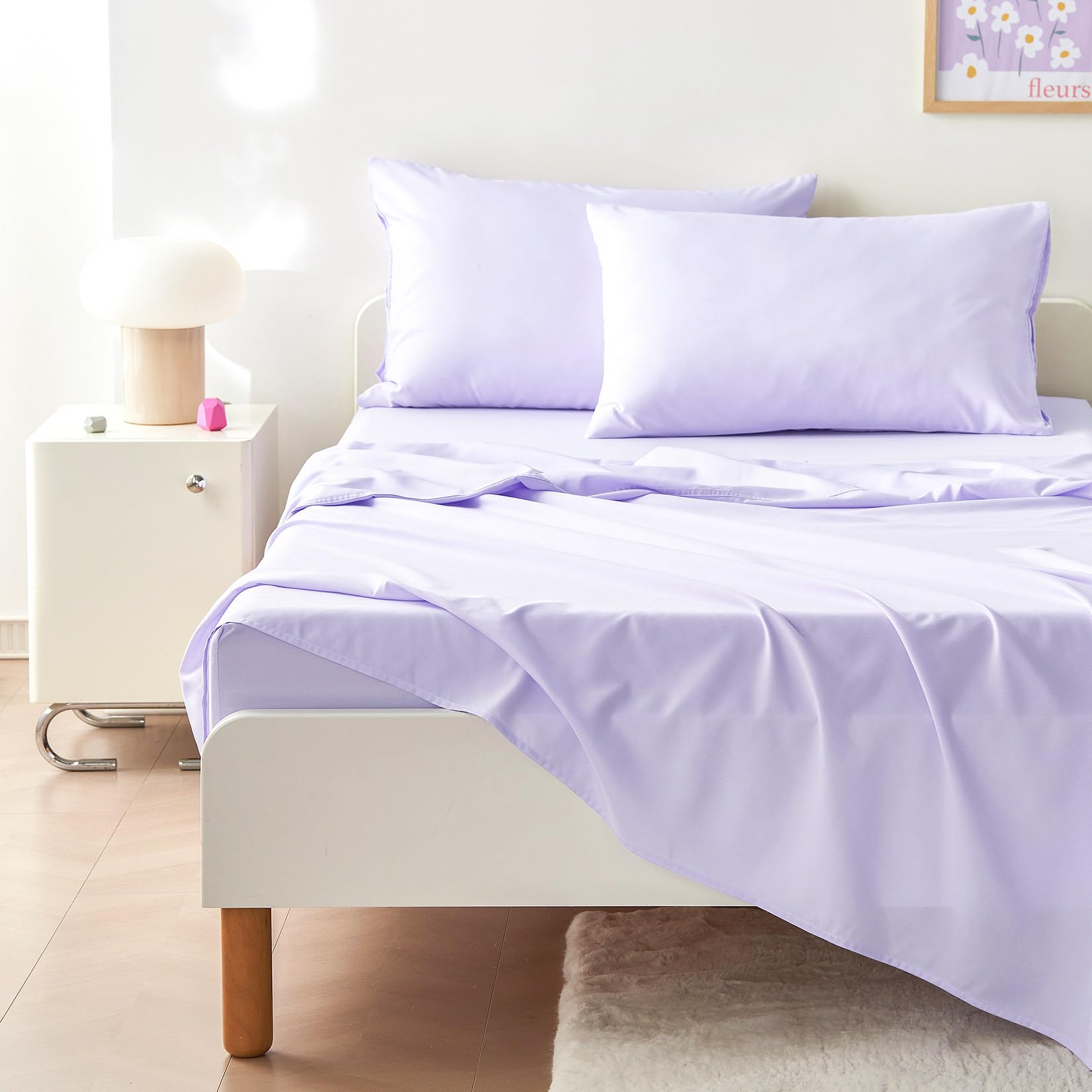 Wake In Cloud pillowcase with blossoms adds color to bedtime.