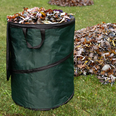 Wakeman Outdoor Trash Can three ground stakes stabilizing on uneven ground.